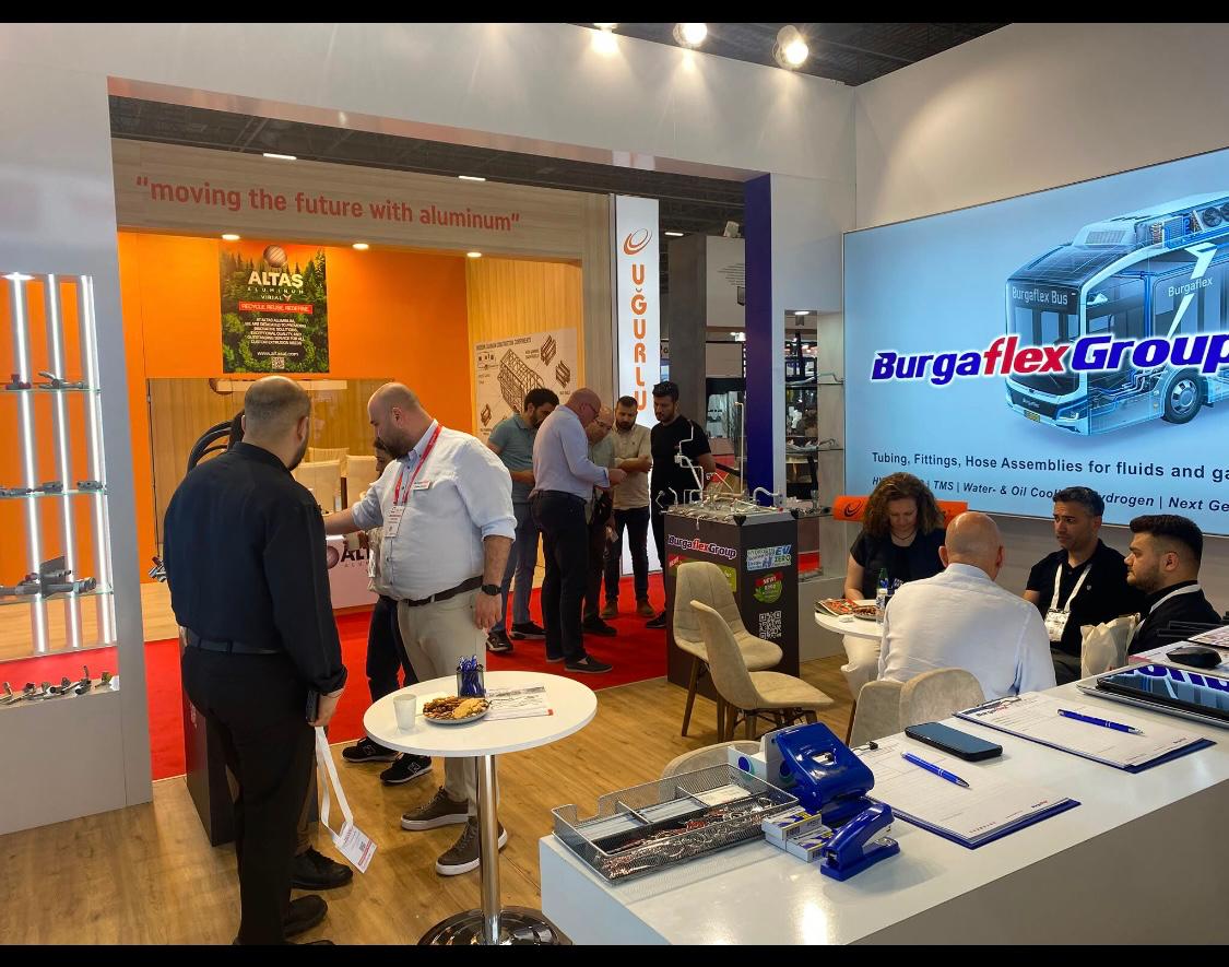 Bar and reception area at the Burgaflex stand with a digital screen for company and product presentations.
