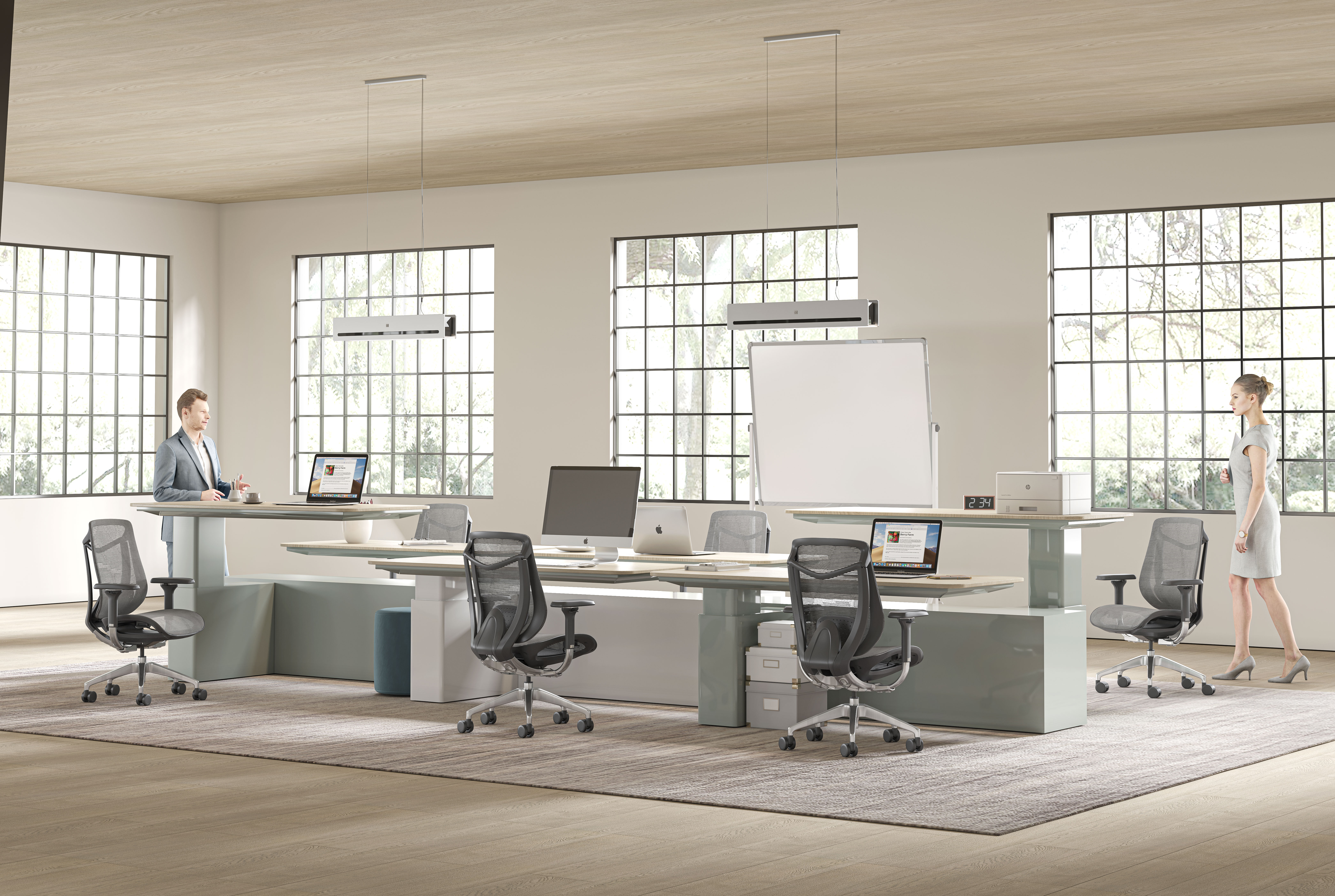 TCHOD Furniture Model No. 833B ergonomic staff chairs with black breathable mesh backrests and adjustable armrests, arranged at a modern height-adjustable workstation in a bright, minimalist office setting.