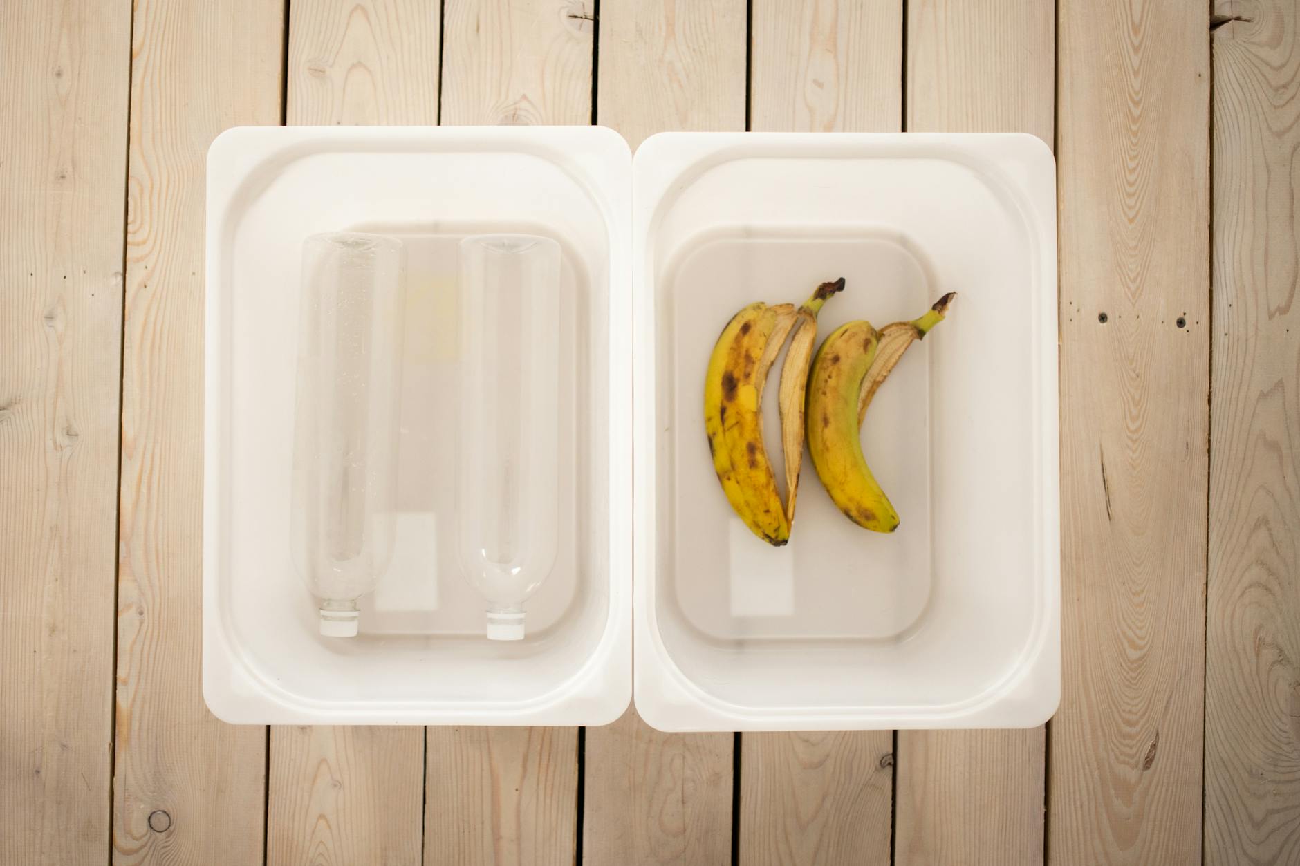 Clear plastic bins labeled by day of the week containing various tactile learning puzzles and flashcards.