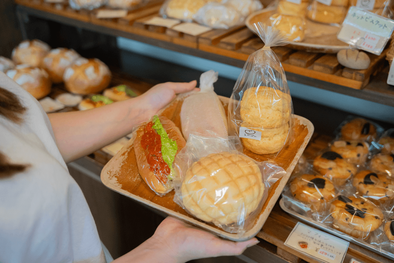 Person with their selection of baked goods