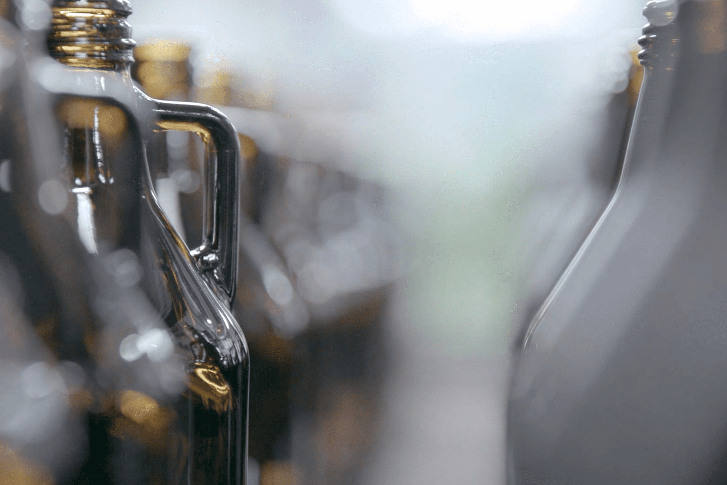 Close-up of bottle necks with bokeh background