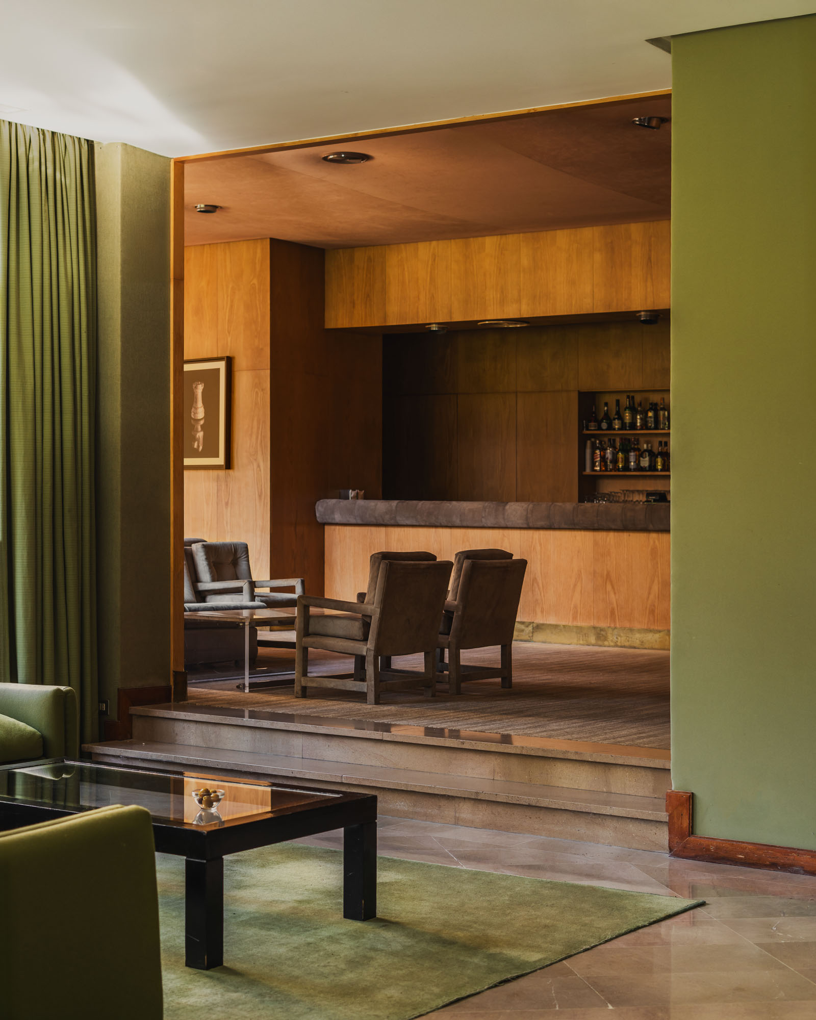 Lounge overlooking the timber-lined bar at El Soto private social club in Burgos.