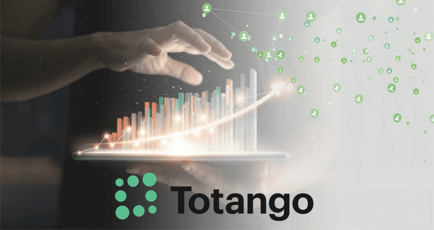 Man holding tablet with growth chart - Gainsight Vs Totango