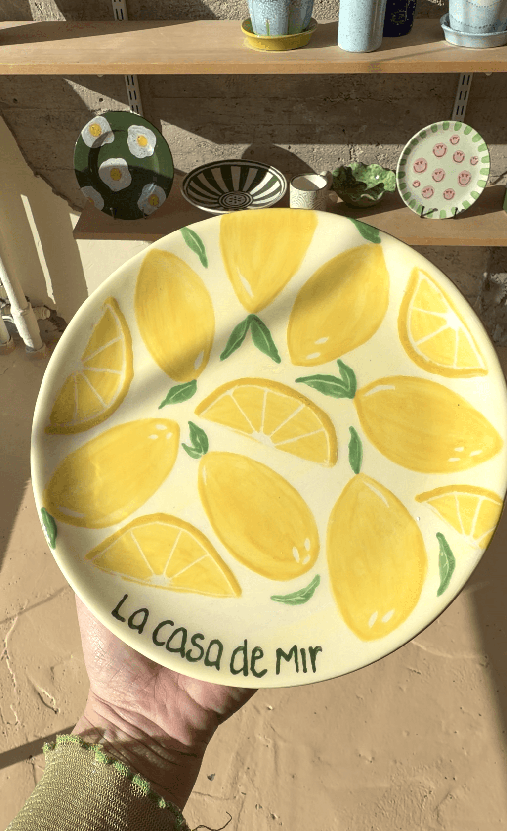 A bottle of daisy perfume with floral accents.