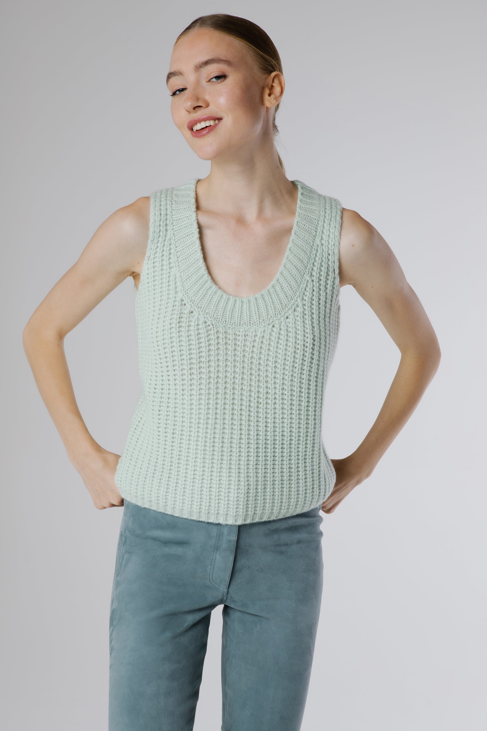 Side profile of the Boheme Cashmere Top Salvia revealing its relaxed fit and soft textured cashmere knit.