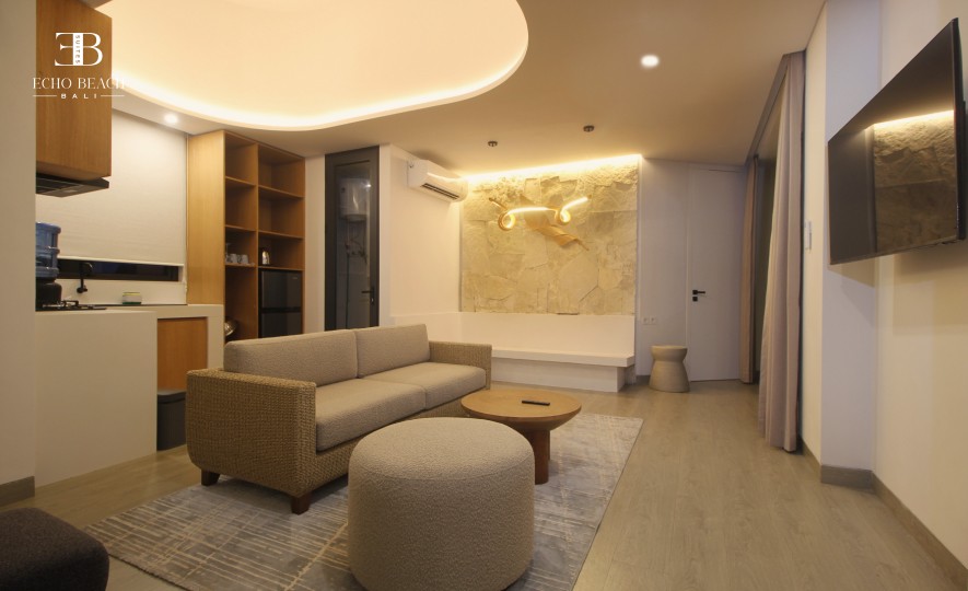 View of the spiral staircase leading to the Mezzanine level of the 1 BR apartment suite at Echo Beach, Canggu, Bali, featuring a modern suite design.