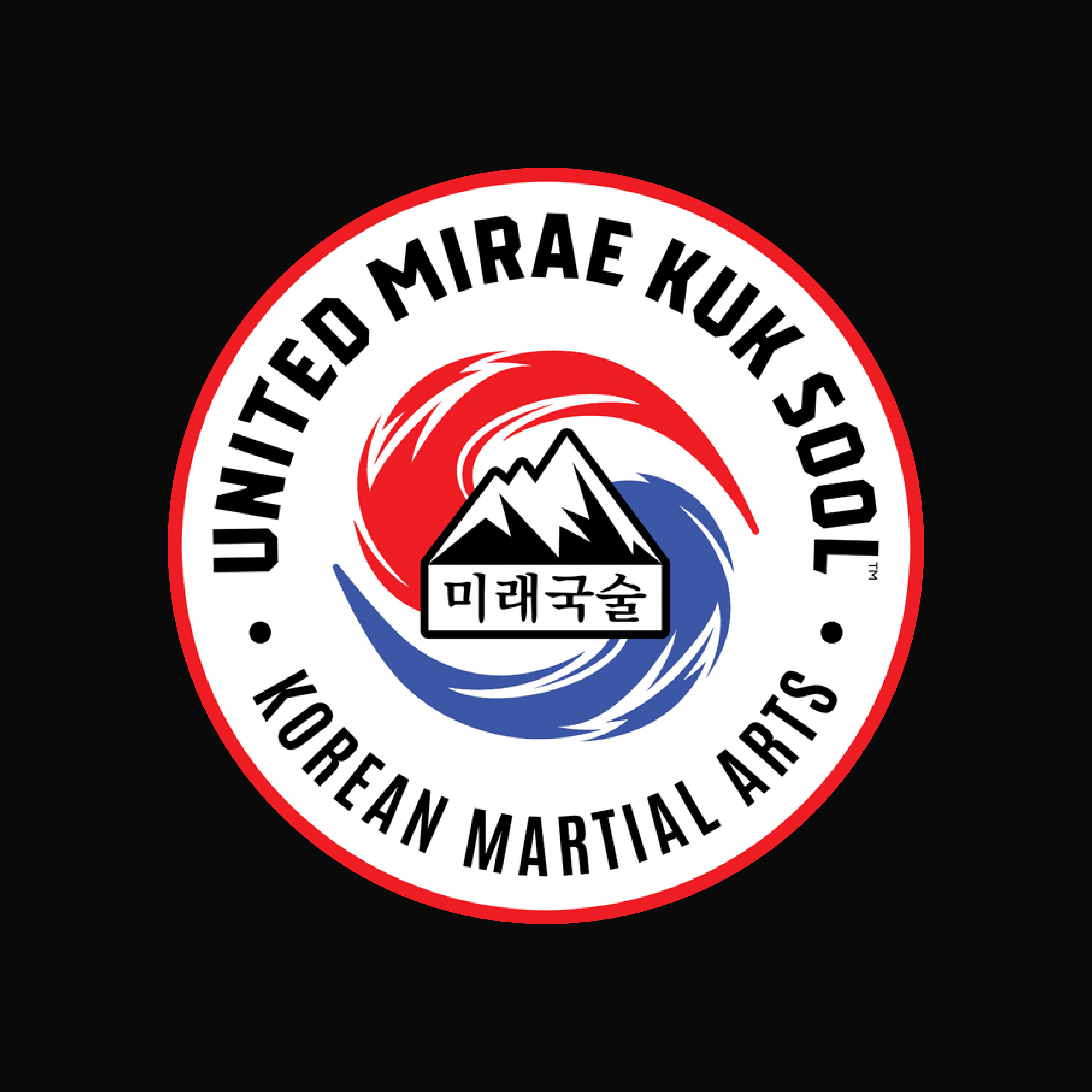Dan in a black martial arts uniform against a blue background featuring the Dragon Spirit logo.