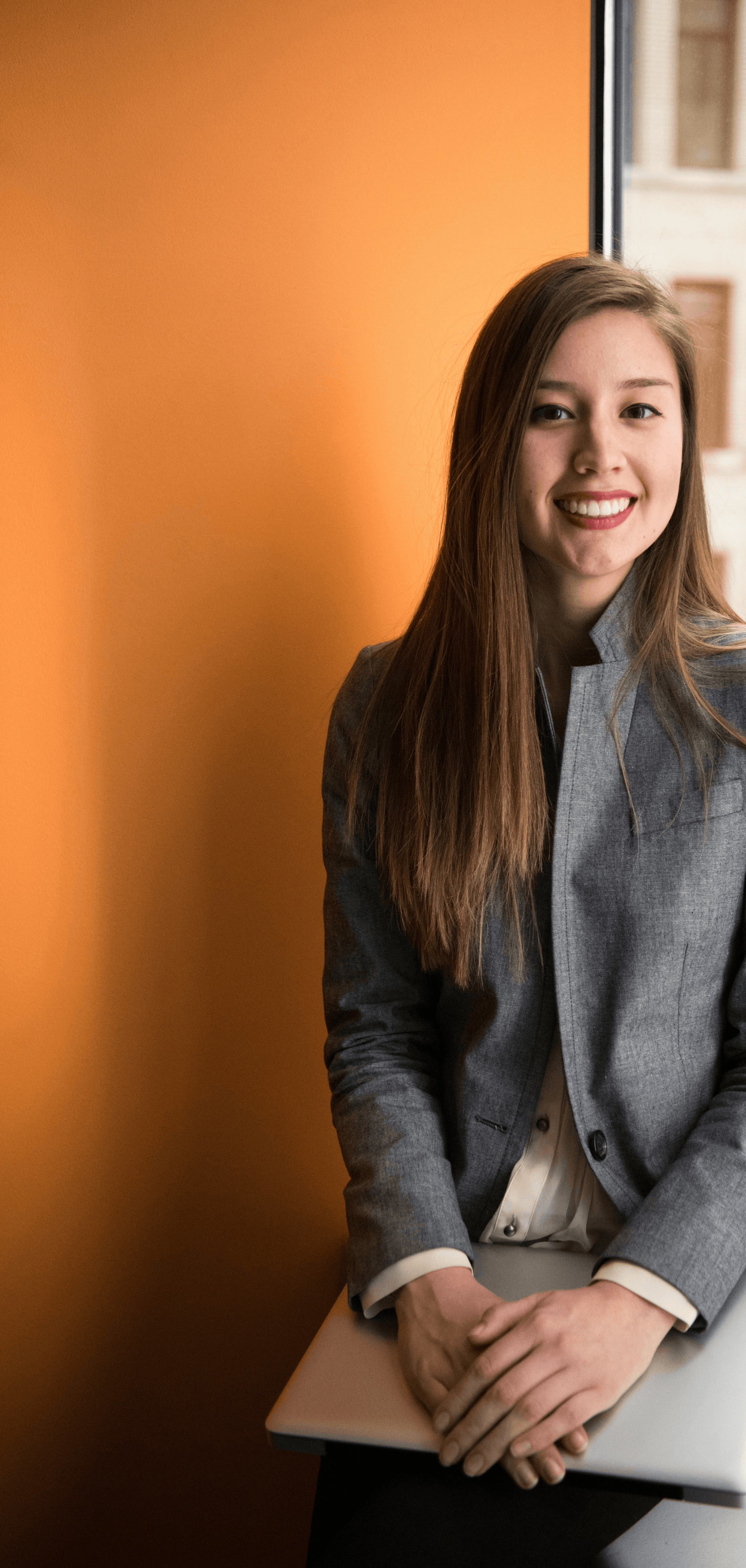 shallow focus photo of woman in gray jacket