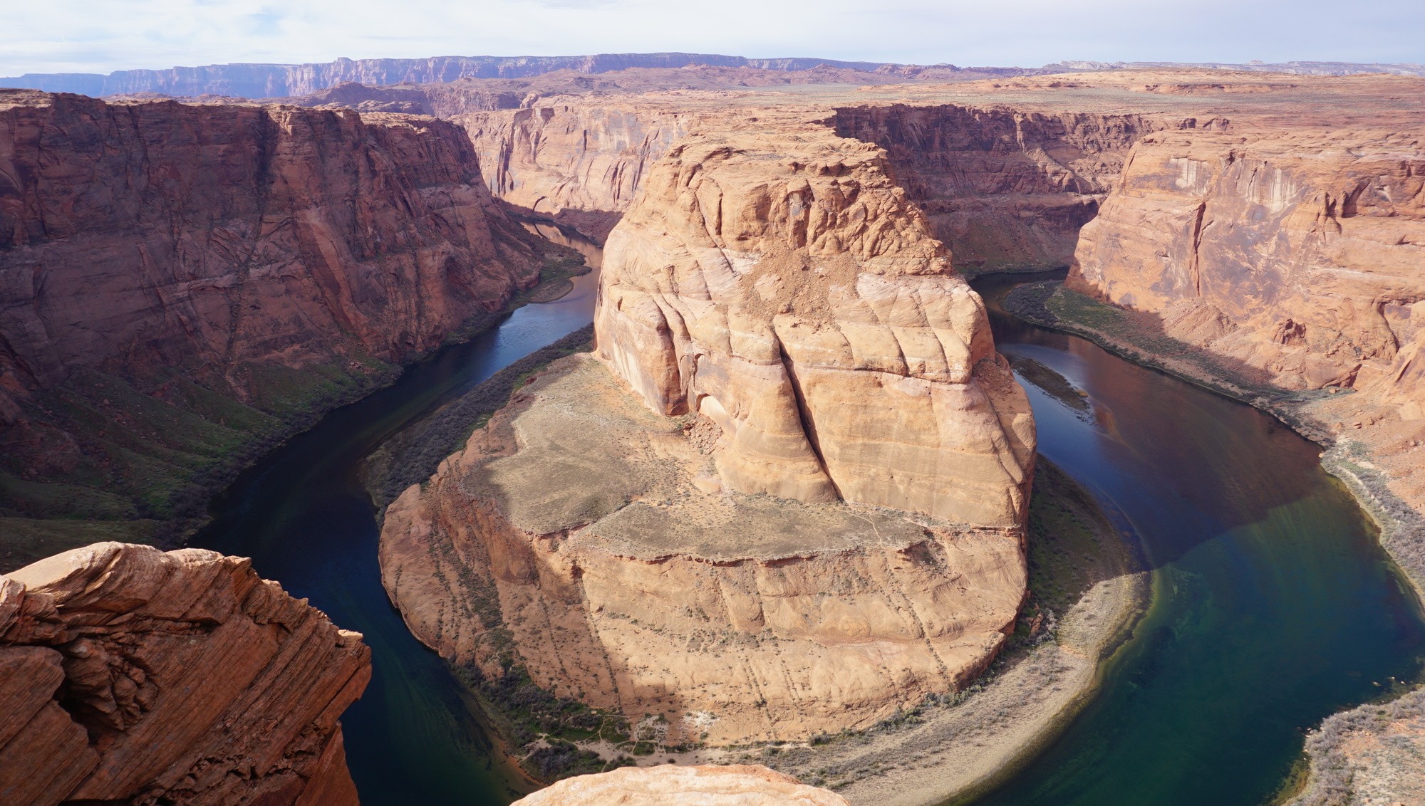 Tropical beach with umbrellas and lounge chairs.