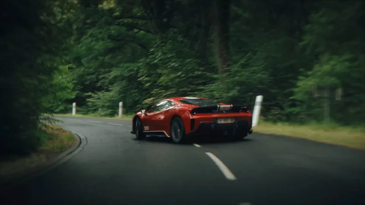 A car drifting through a corner on a mountain road