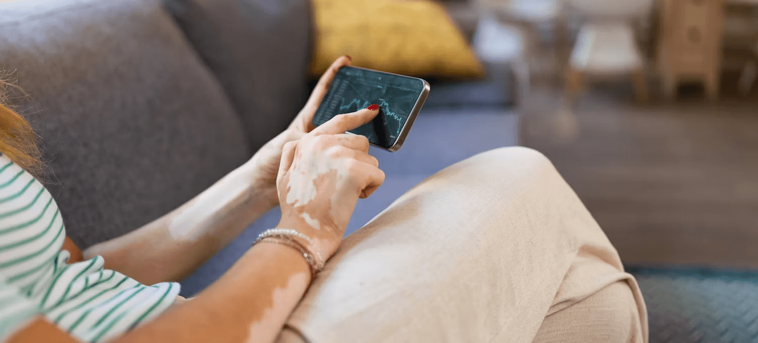 Woman viewing financial data on mobile phone - GMGN AI Alternative 