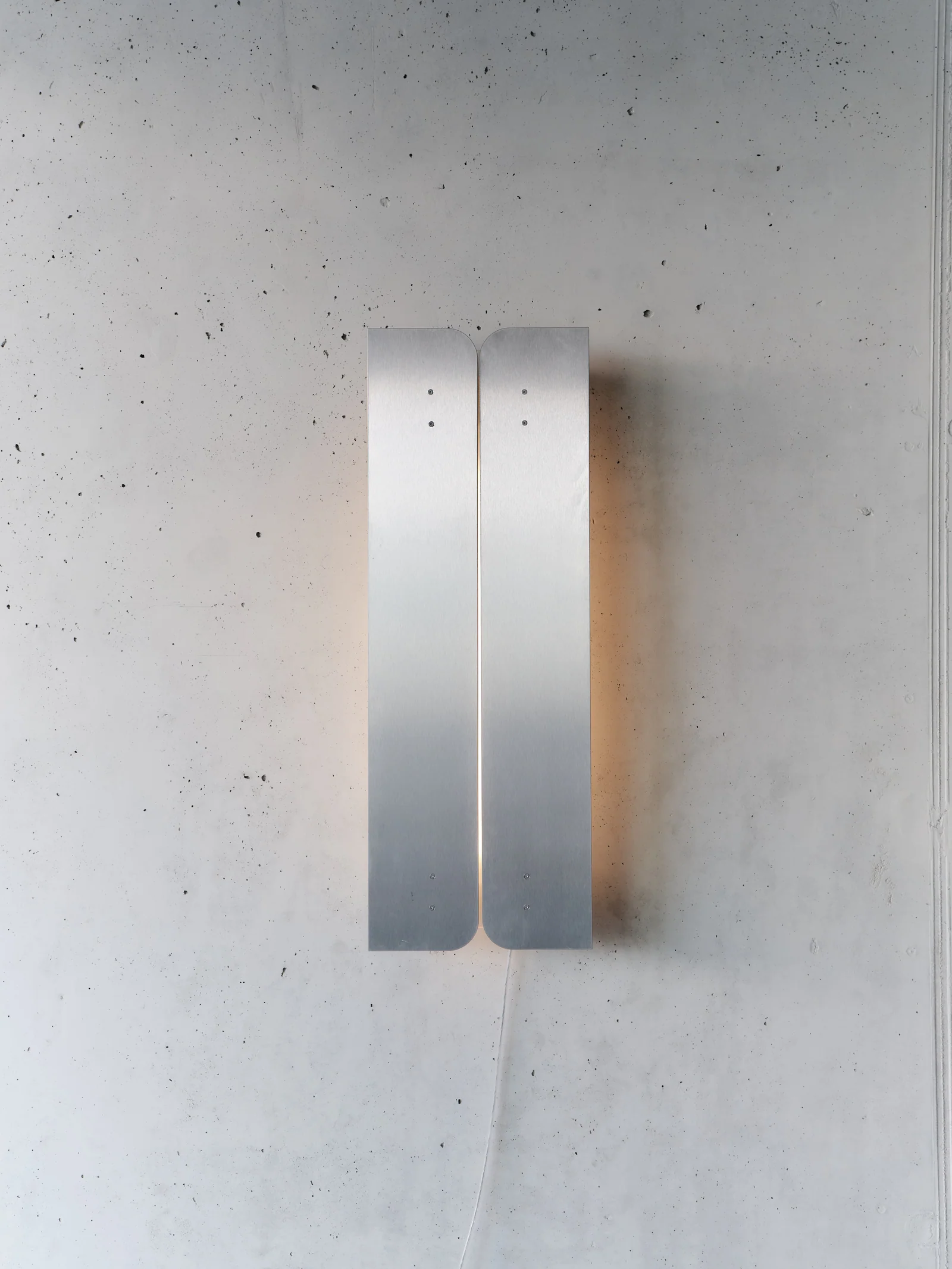 S30 volet wall lamp, folded stainless steel with adjustable front plates over an acrylic diffuser