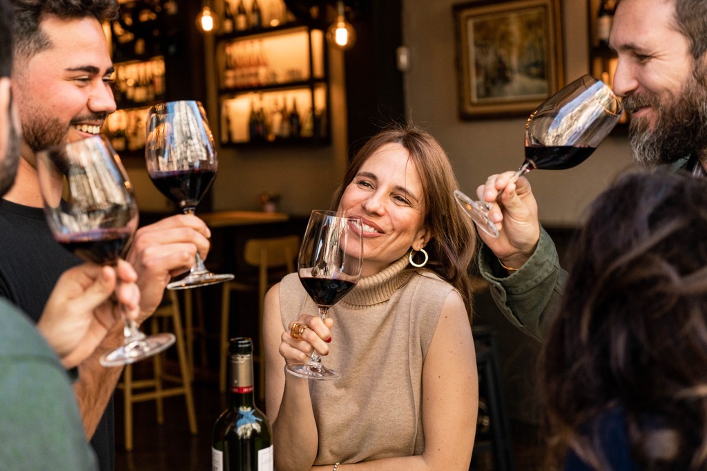 Small group enjoying a relaxed wine tasting experience in Barcelona
