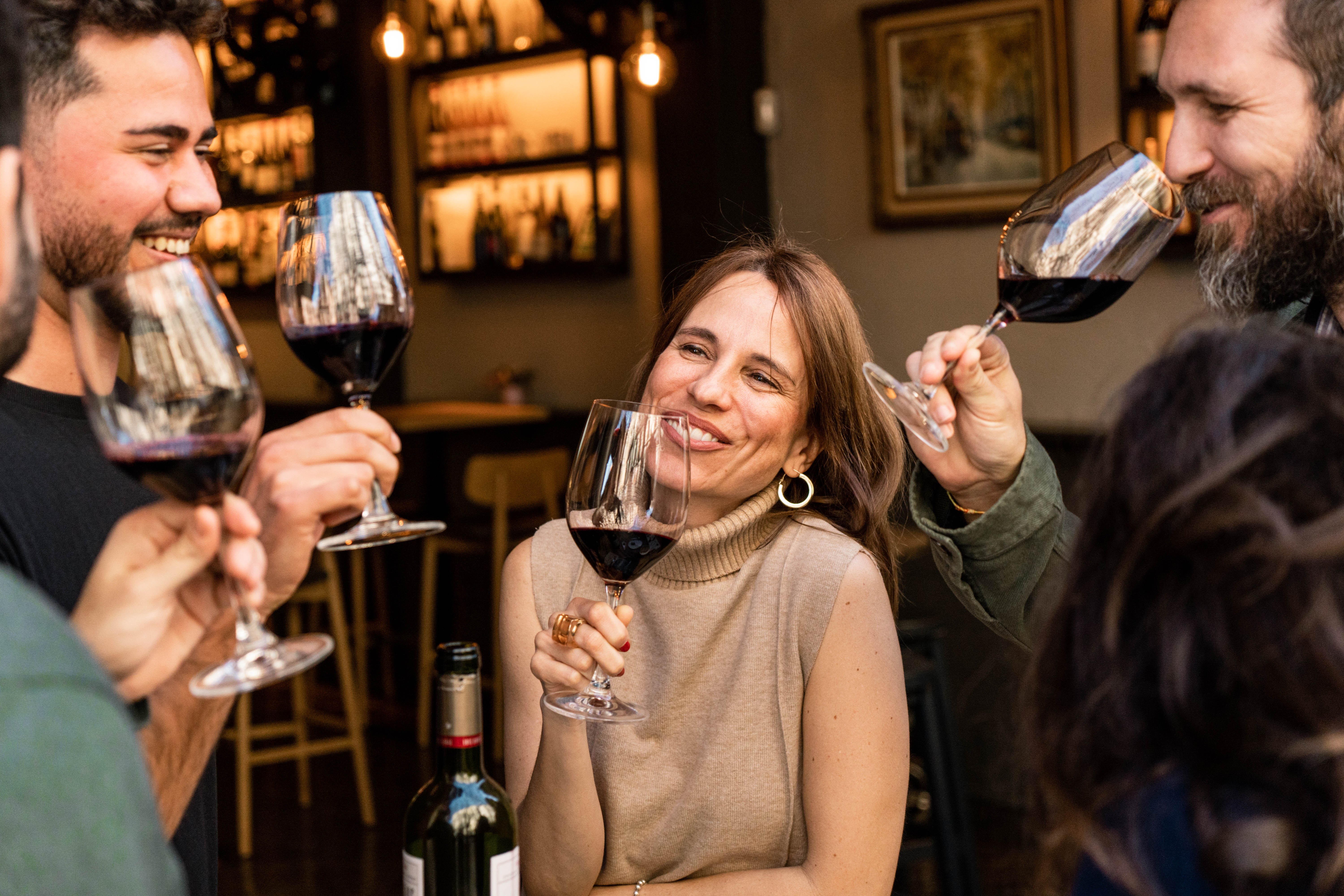 Small group enjoying a wine tasting experience during a Barcelona food and wine tour.