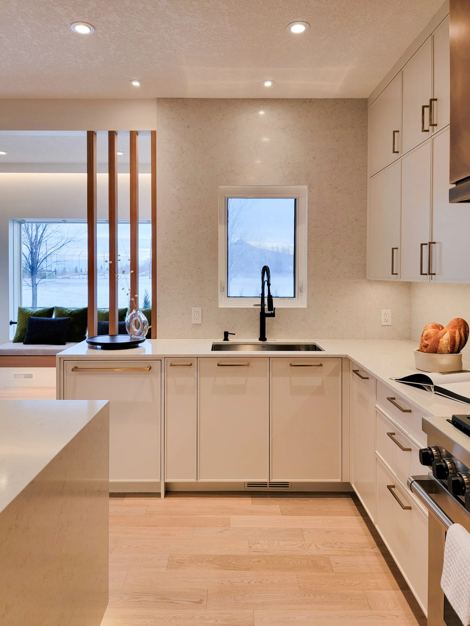 Image of warm modern kitchen with full slab wall tile.