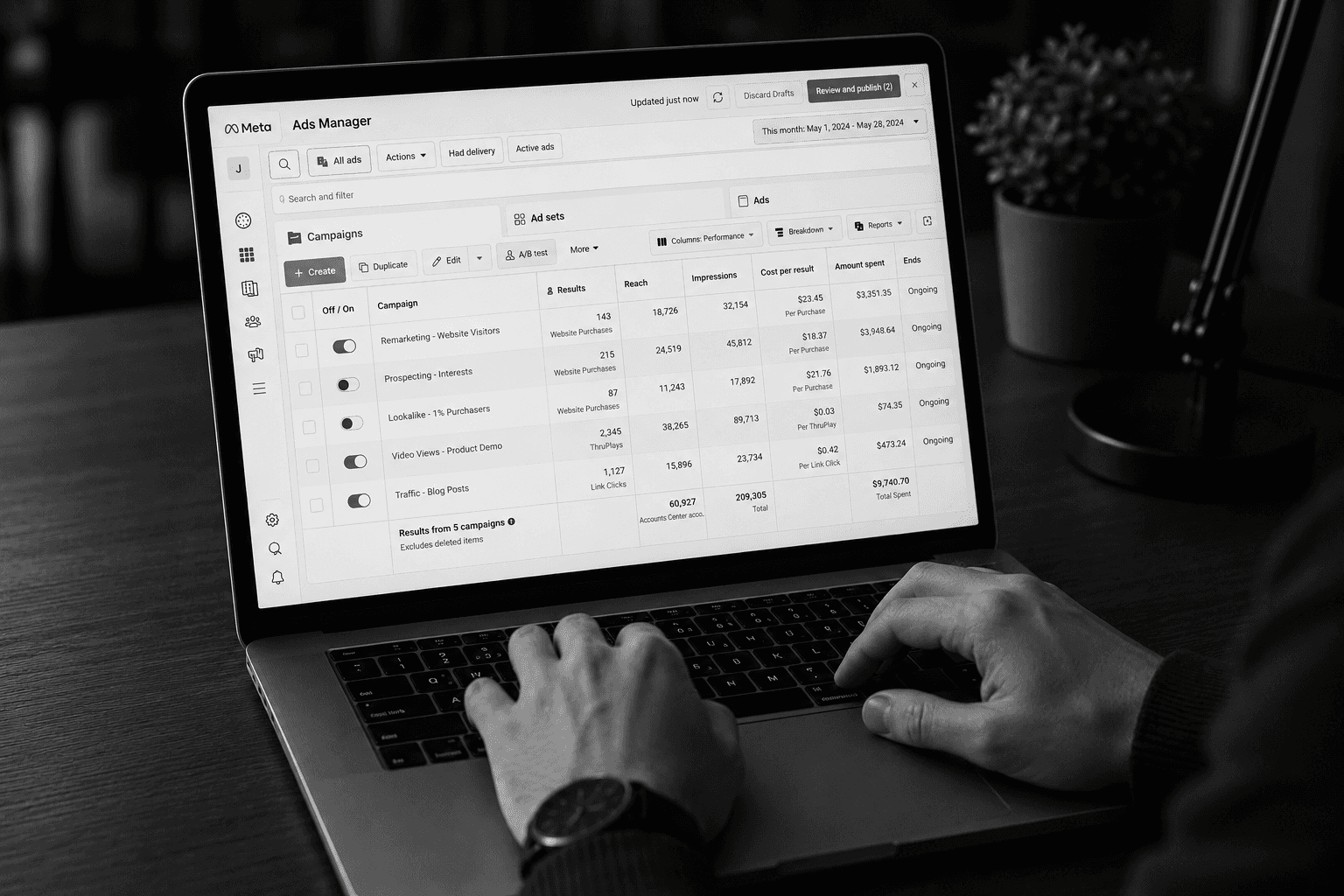  Small business owner reviewing Meta ad performance dashboard on a laptop
