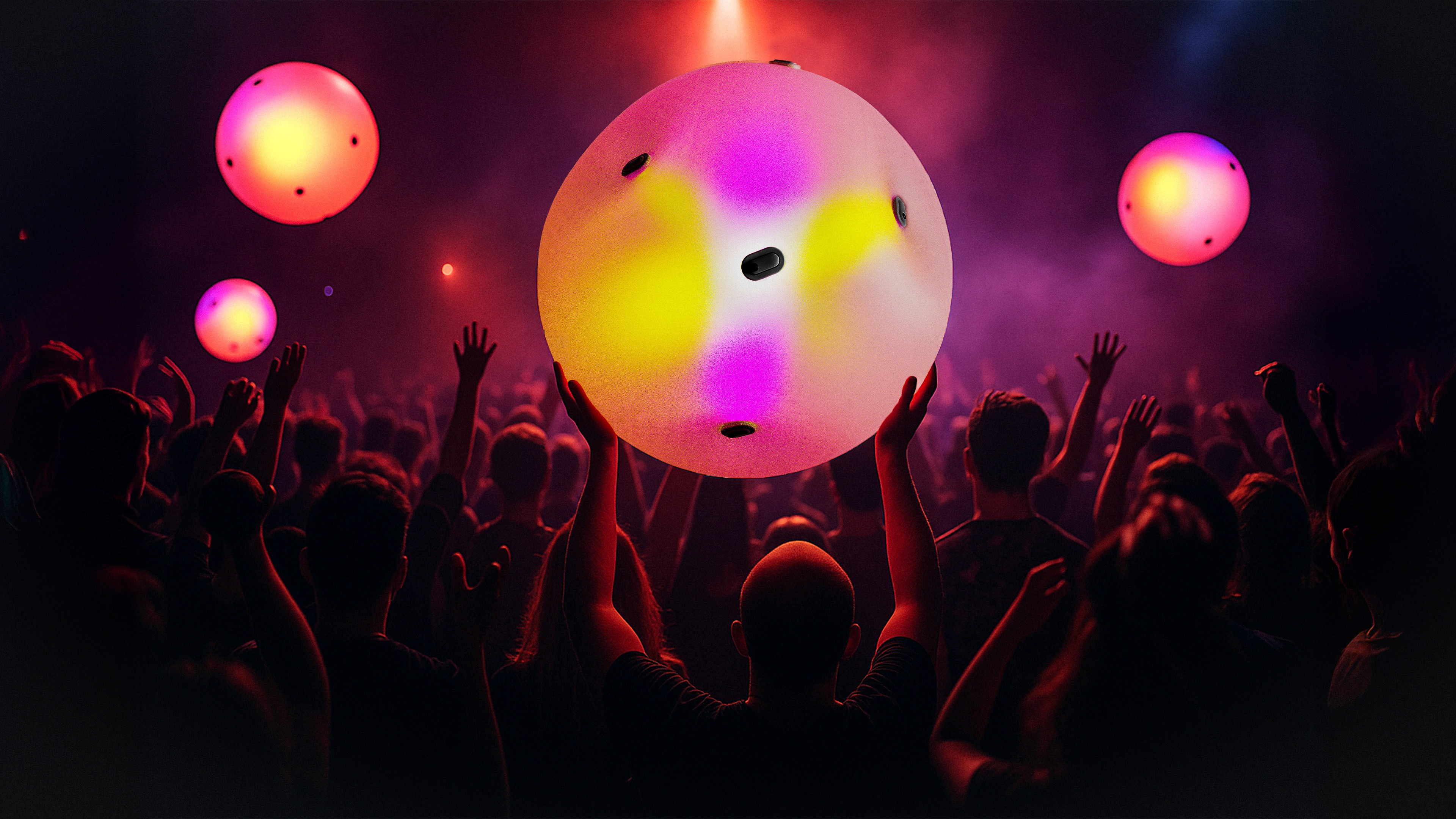 man wearing grey t-shirt standing in front of man sitting on chair