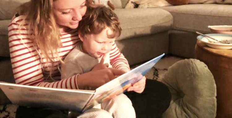 Angel Eveline with her babysitting child