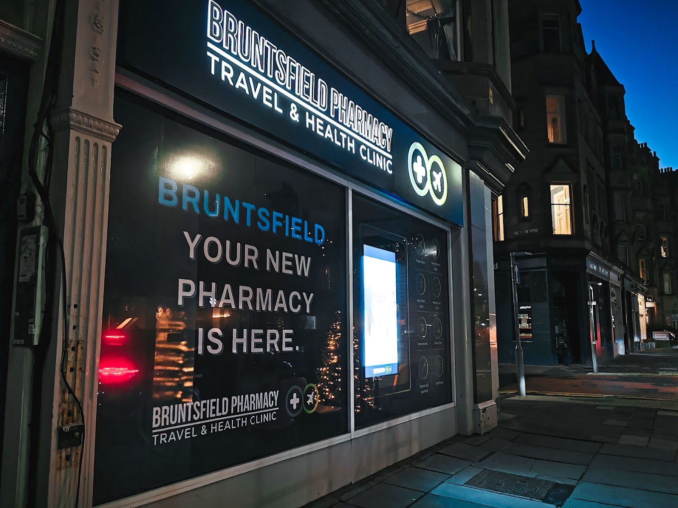 Brunstfield Pharmacy lit up at night