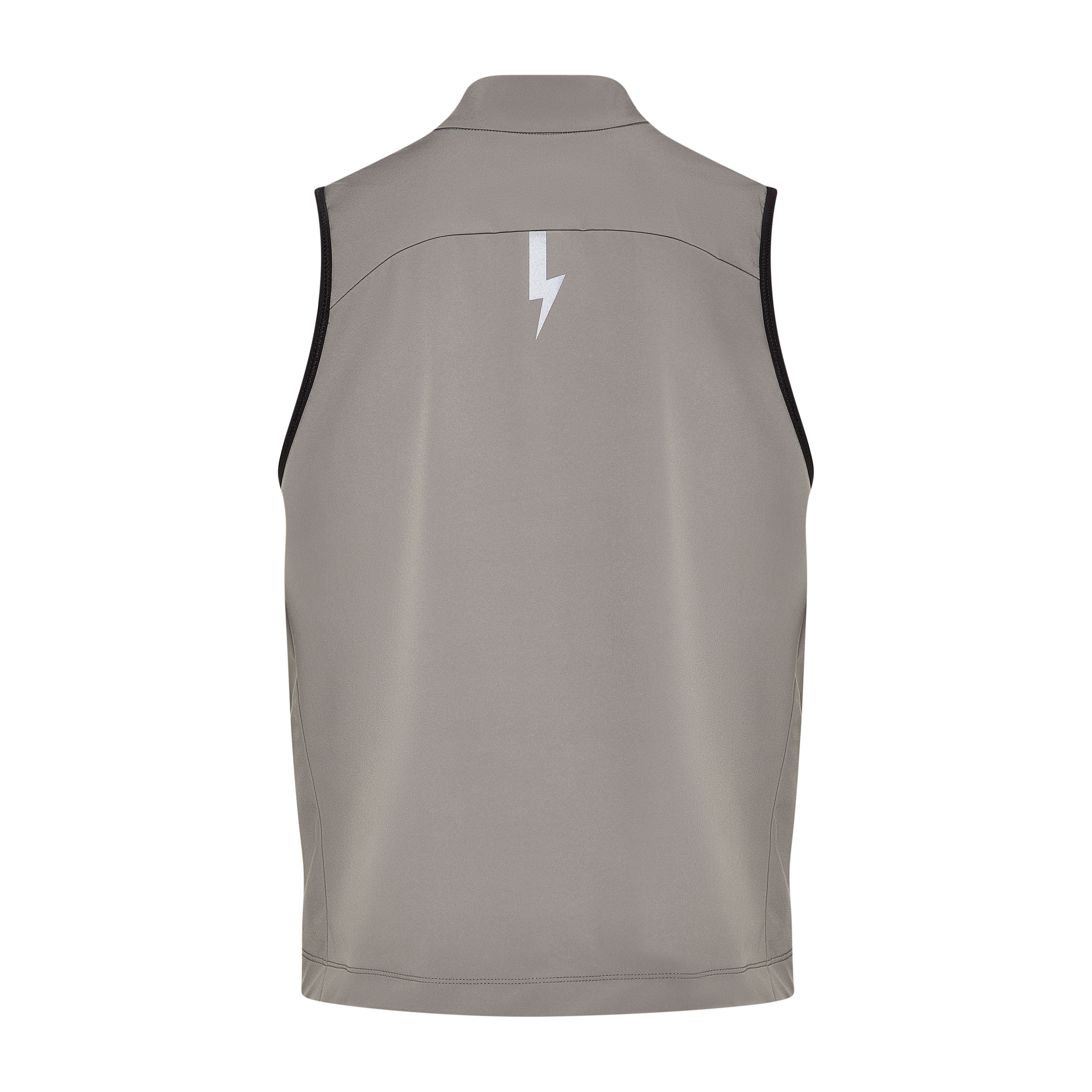 Back-of-the-back-of-the-taupe-grey-Luca-cycling-gilet-on-a-whitebackground-highlighting-the-large-reflctive-lighting-bolt-graphic-centered-on-the-upper-back-for-high-visibility-The-curved-stiching-detail-and-black-trim-around-the-armholes-are-also-visible