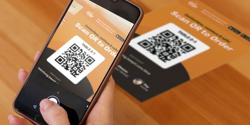 A customer scanning a QR Code to order her food
