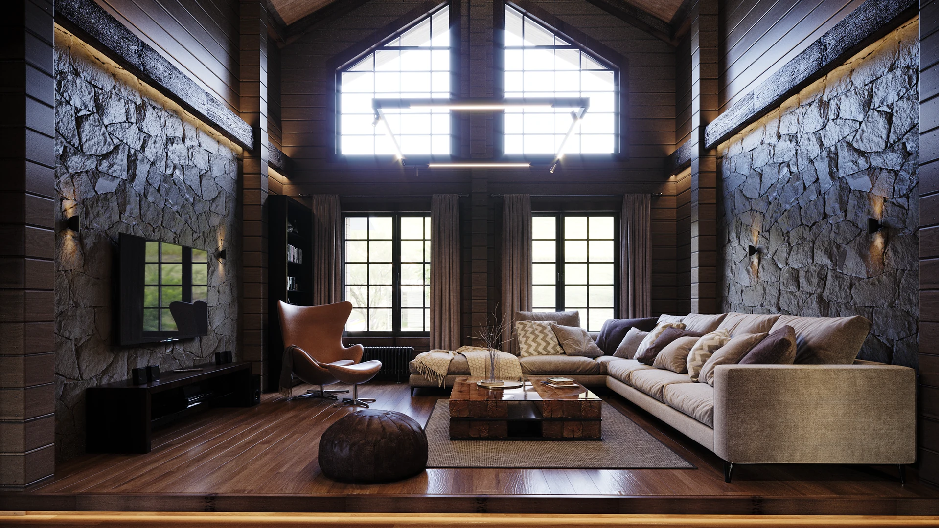 Mur en pierre du salon avec éclairage rasant chaud.