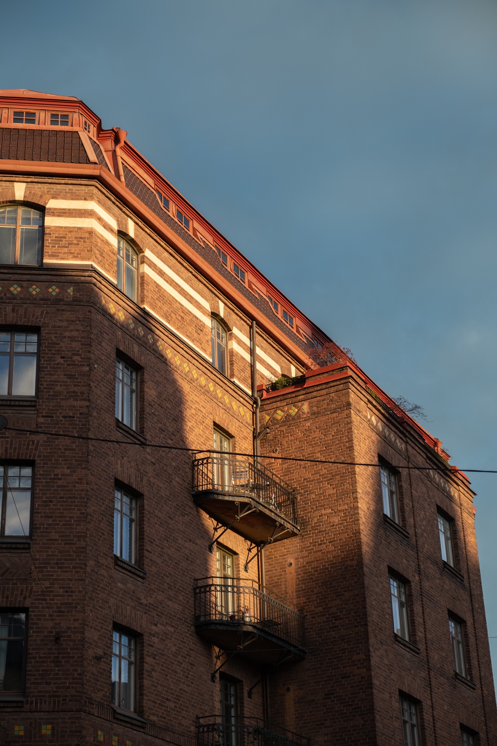 Warm evening light across a brick façade in Stockholm