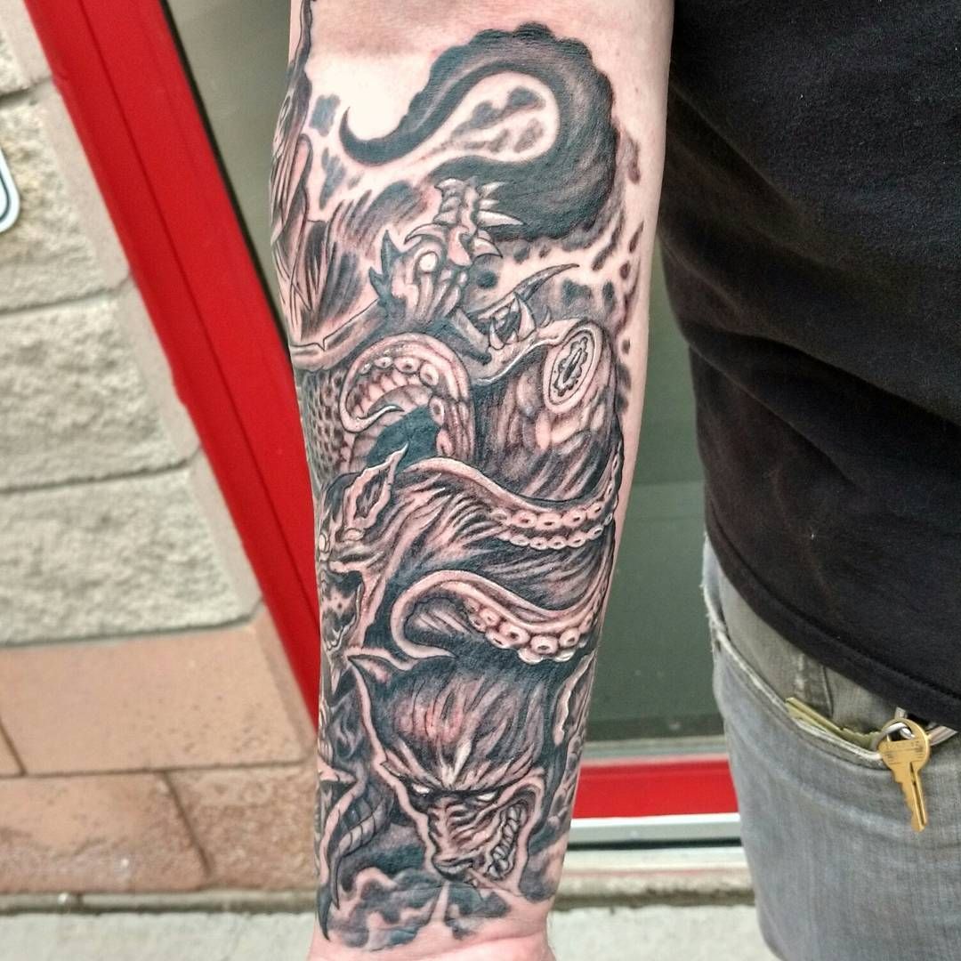 Black-and-grey sleeve tattoo on a forearm