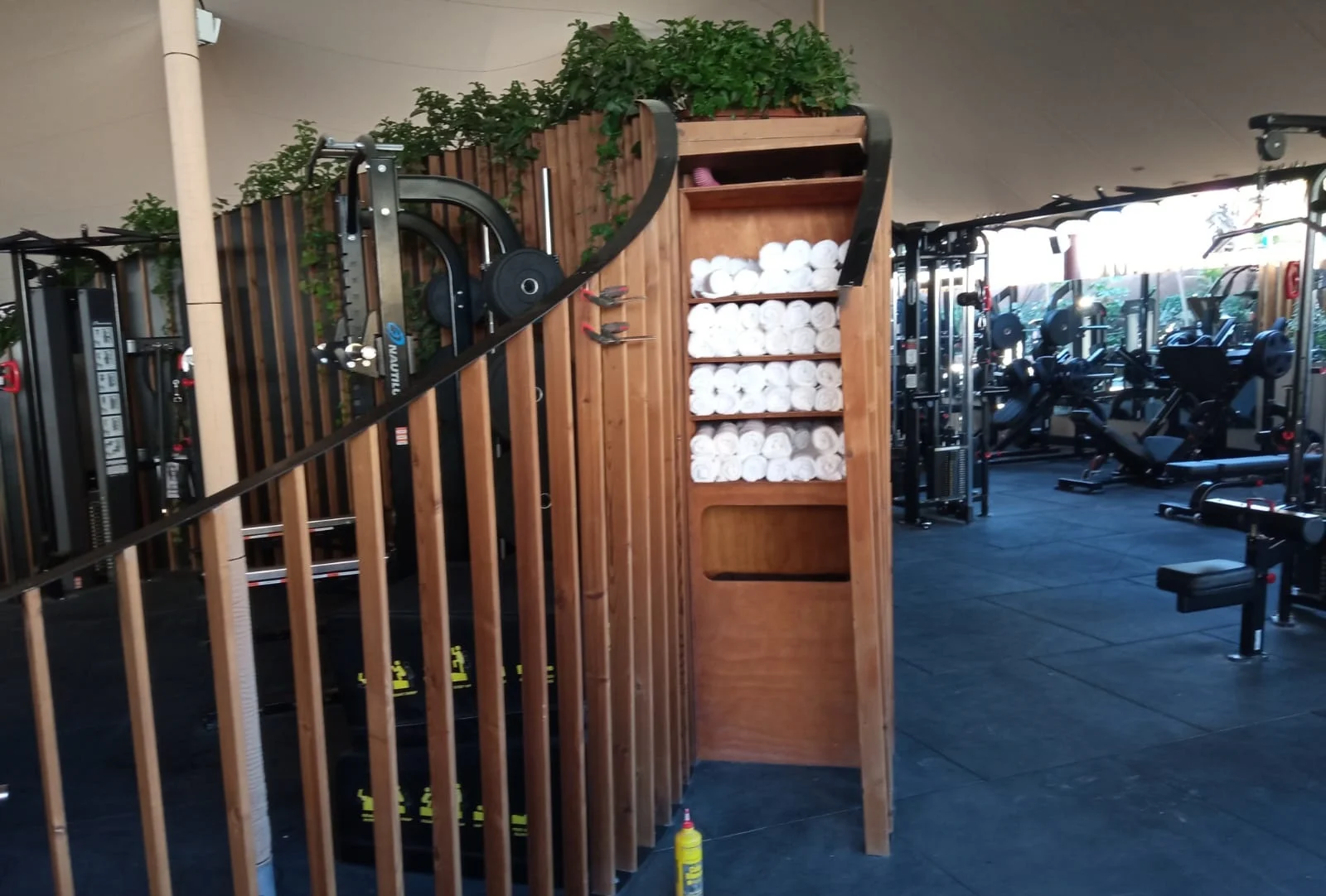 Golden cross atop a domed building with blue sky.