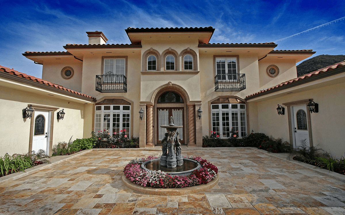 Another exterior view of the courtyard with a fountain, emphasizing the tranquil and welcoming space.