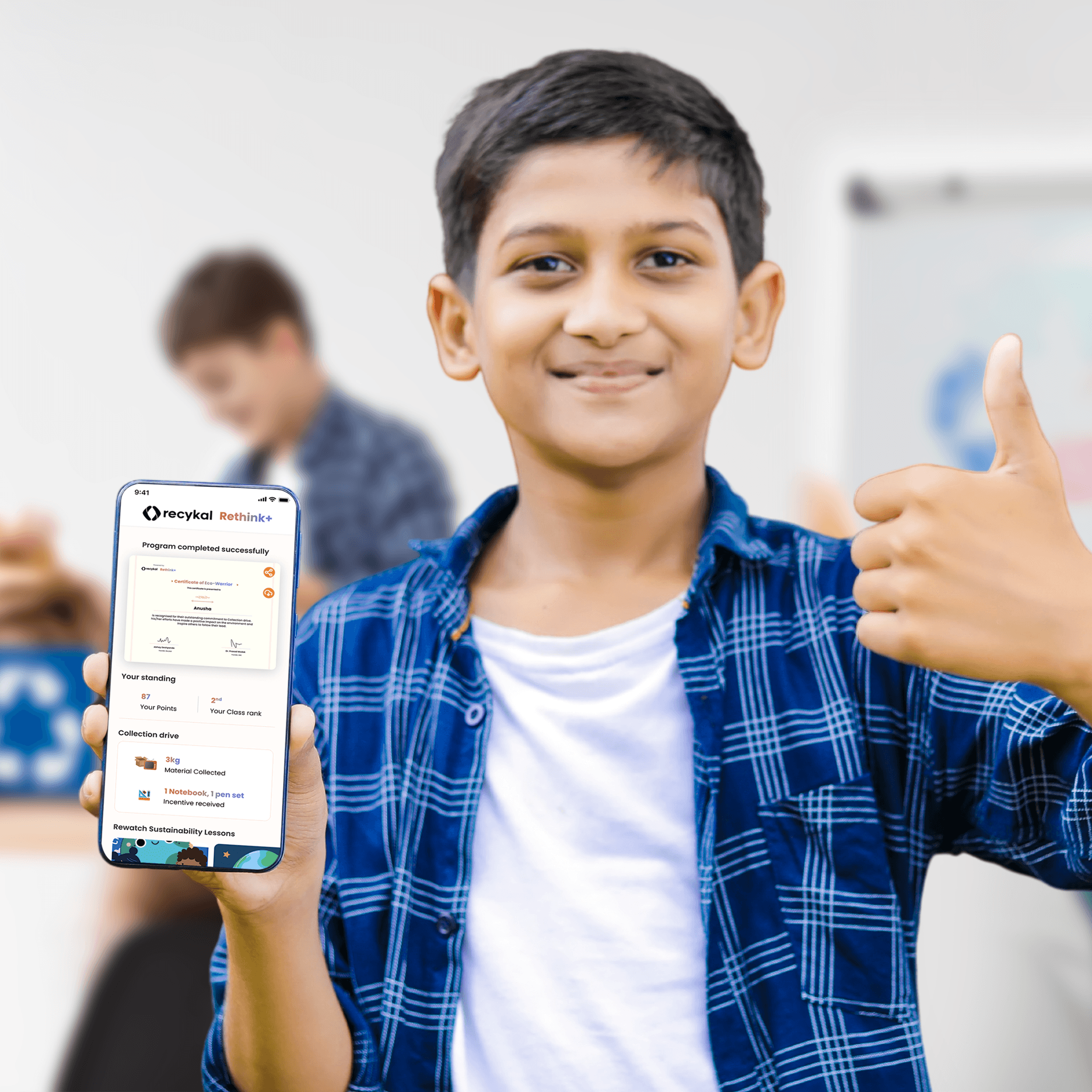 Woman in red outfit poses by a red telephone booth.
