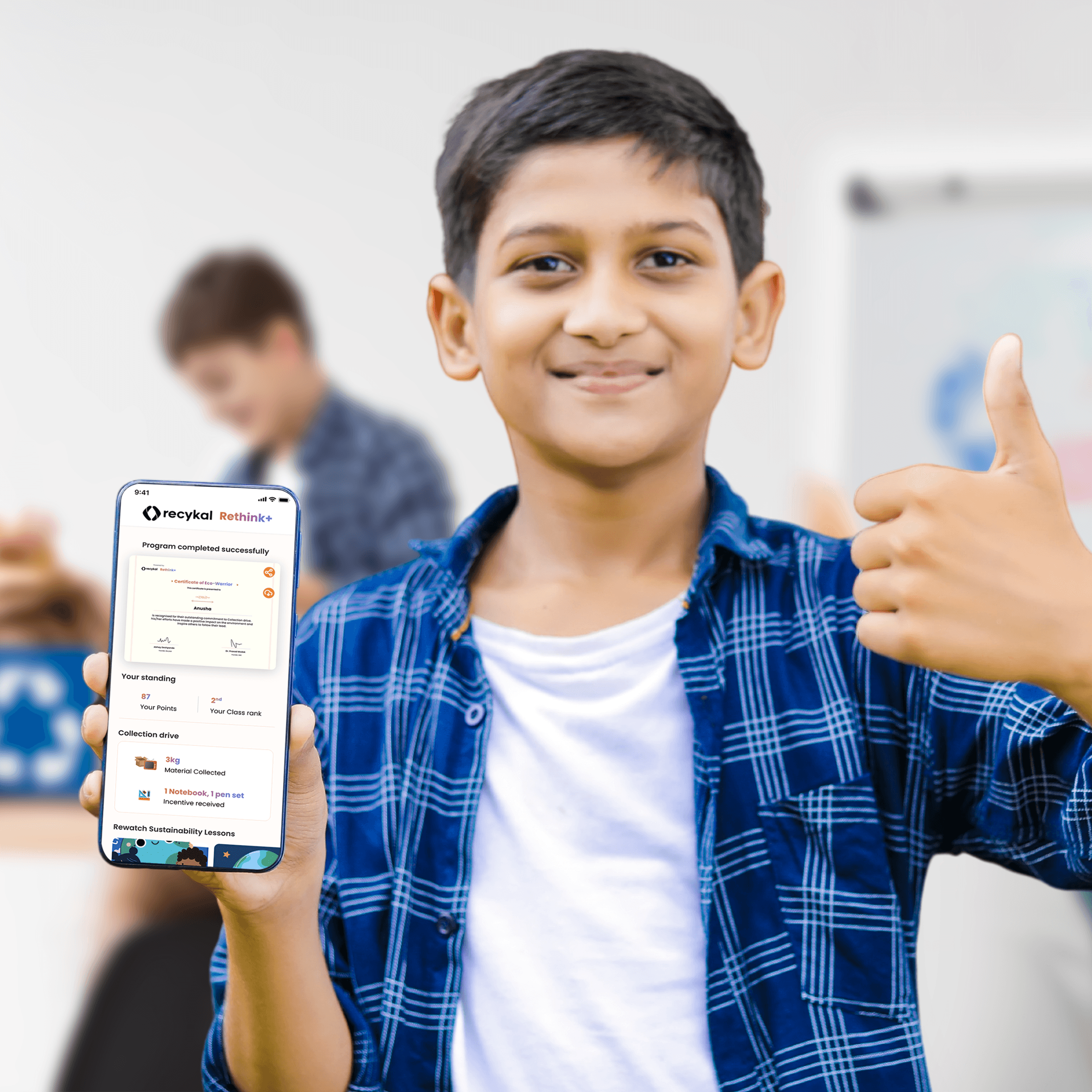 Woman in red outfit poses by a red telephone booth.