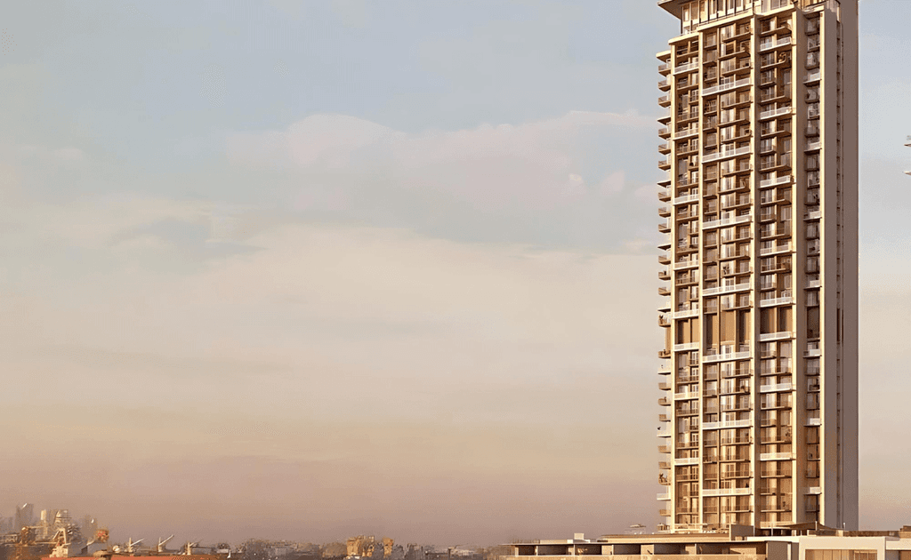 A tower for Anwa Aria by Omniyat is being built amidst the water, emphasizing its striking architectural design.
