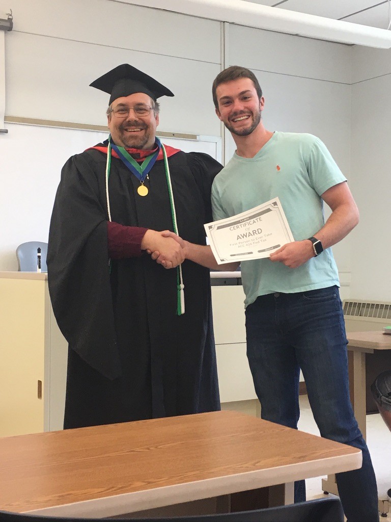 Brandon receiving a certificate award