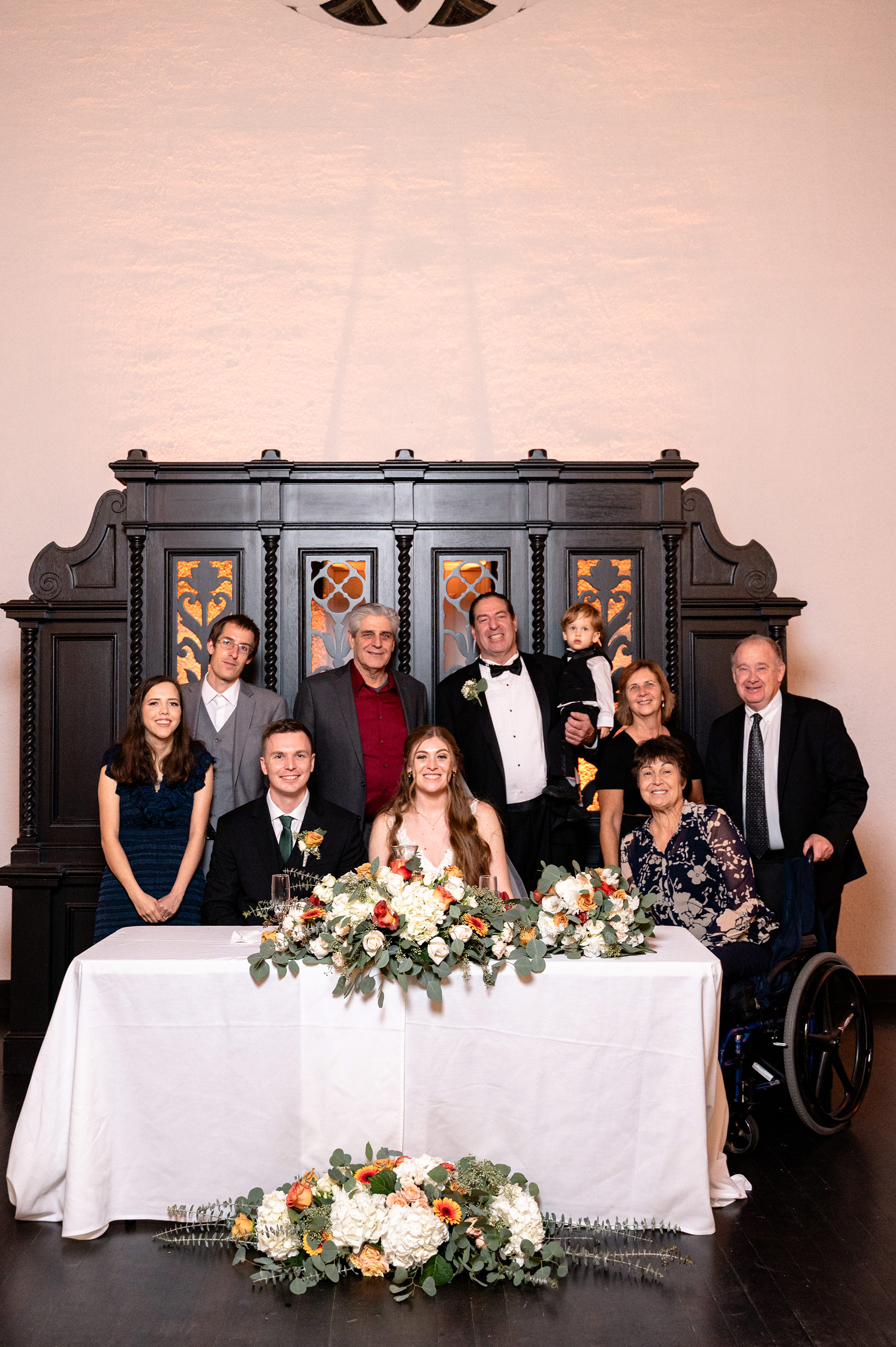 Flat lay wedding details with bouquet, rings, and sparkling bridal heels