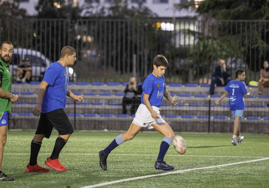 child player kicking a ball