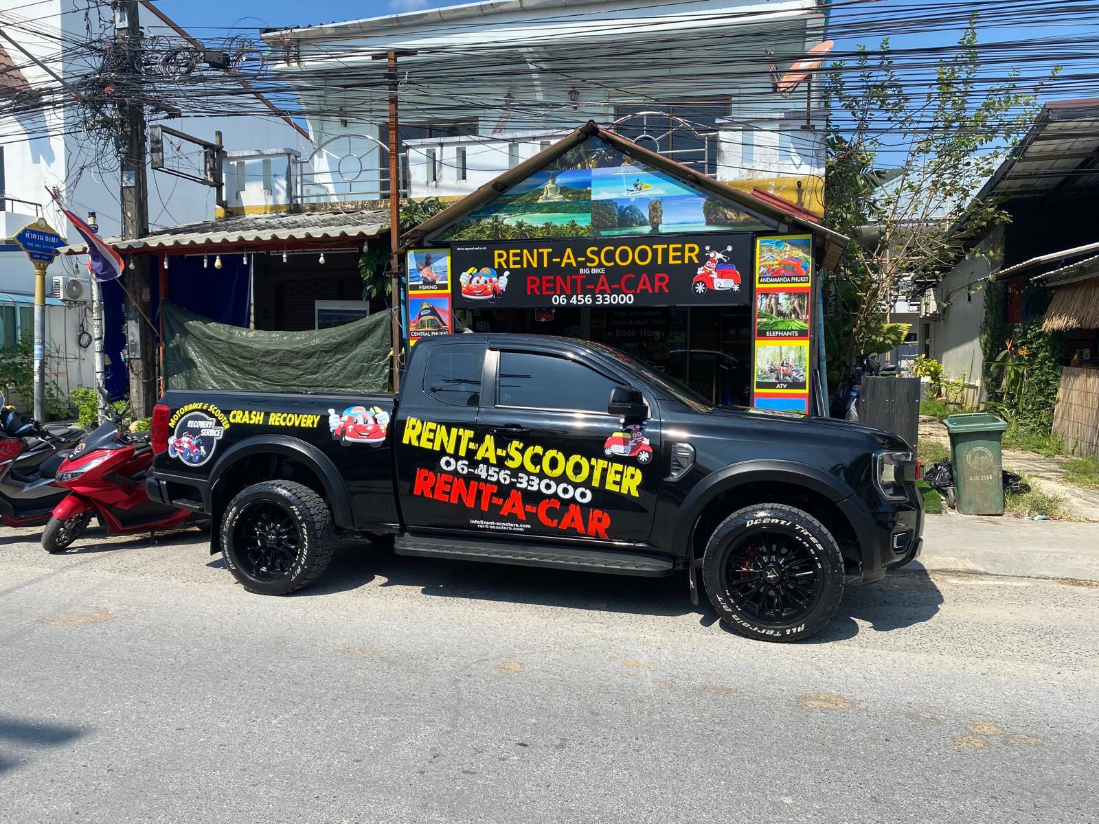 Man on scooter by the ocean at sunset.
