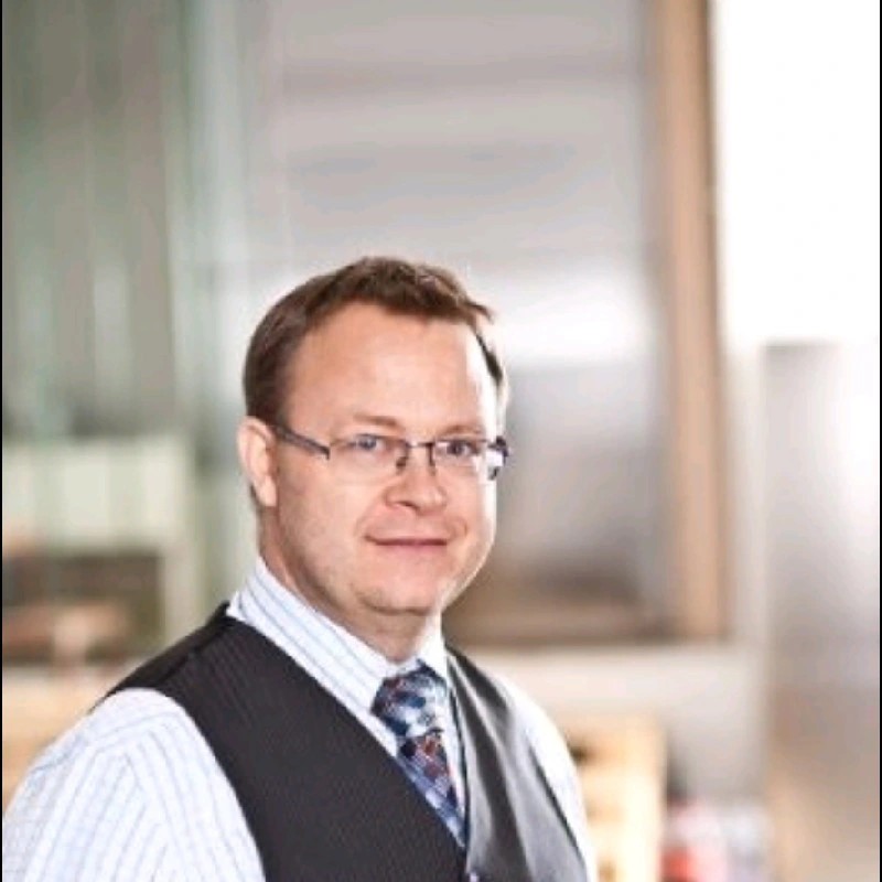 Man with glasses in a suit portrait