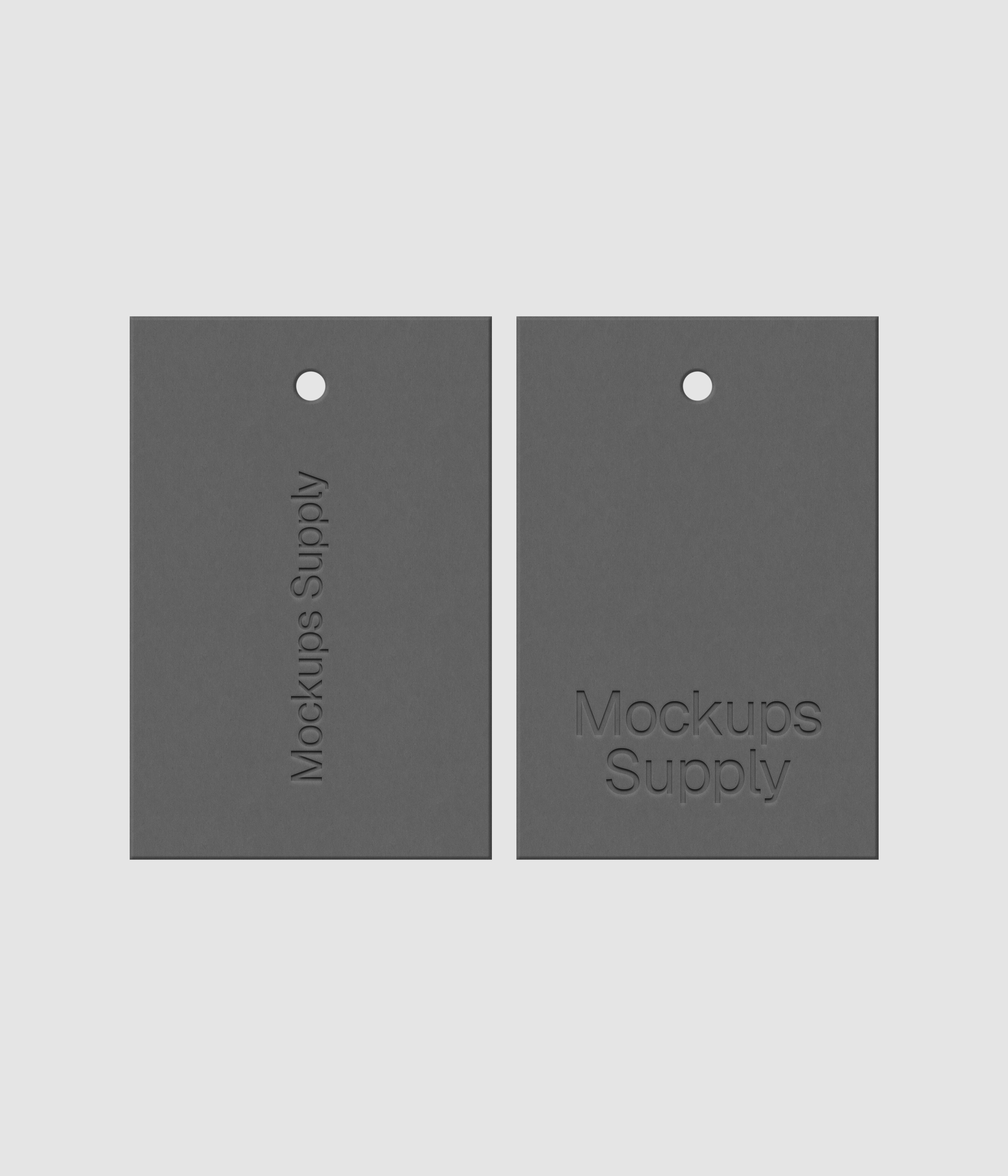 Two gray 2x3 hang tags mockup on white background with debossed logo effect and detailed paper texture for Photoshop download psd