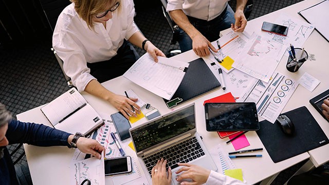 a team working at a table.