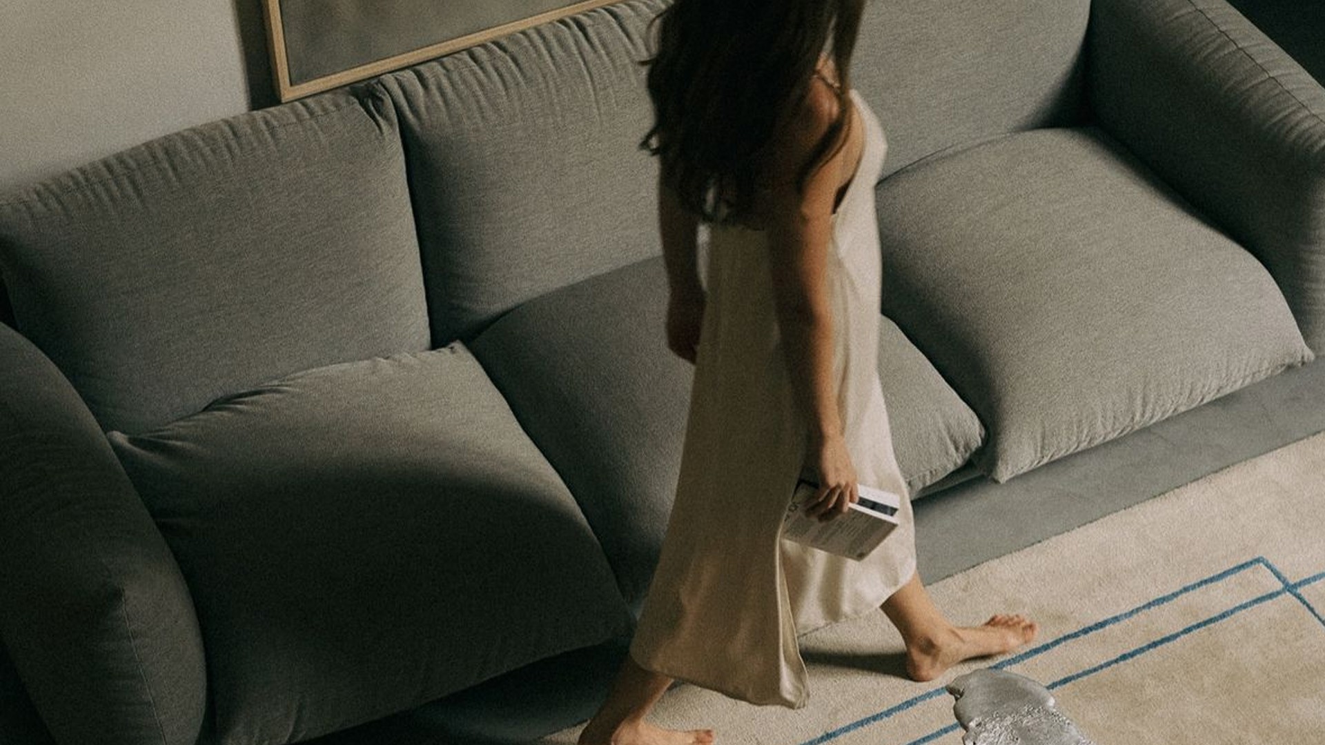 black laptop computer on white textile