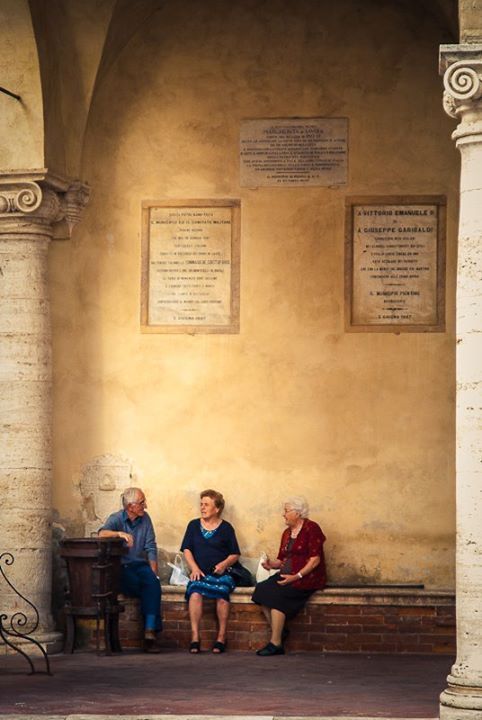 Narrow stone street in Pienza, Tuscany, with warm afternoon light