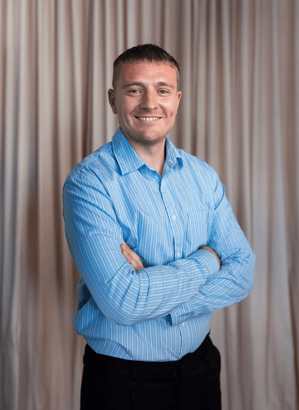 man standing beside wall