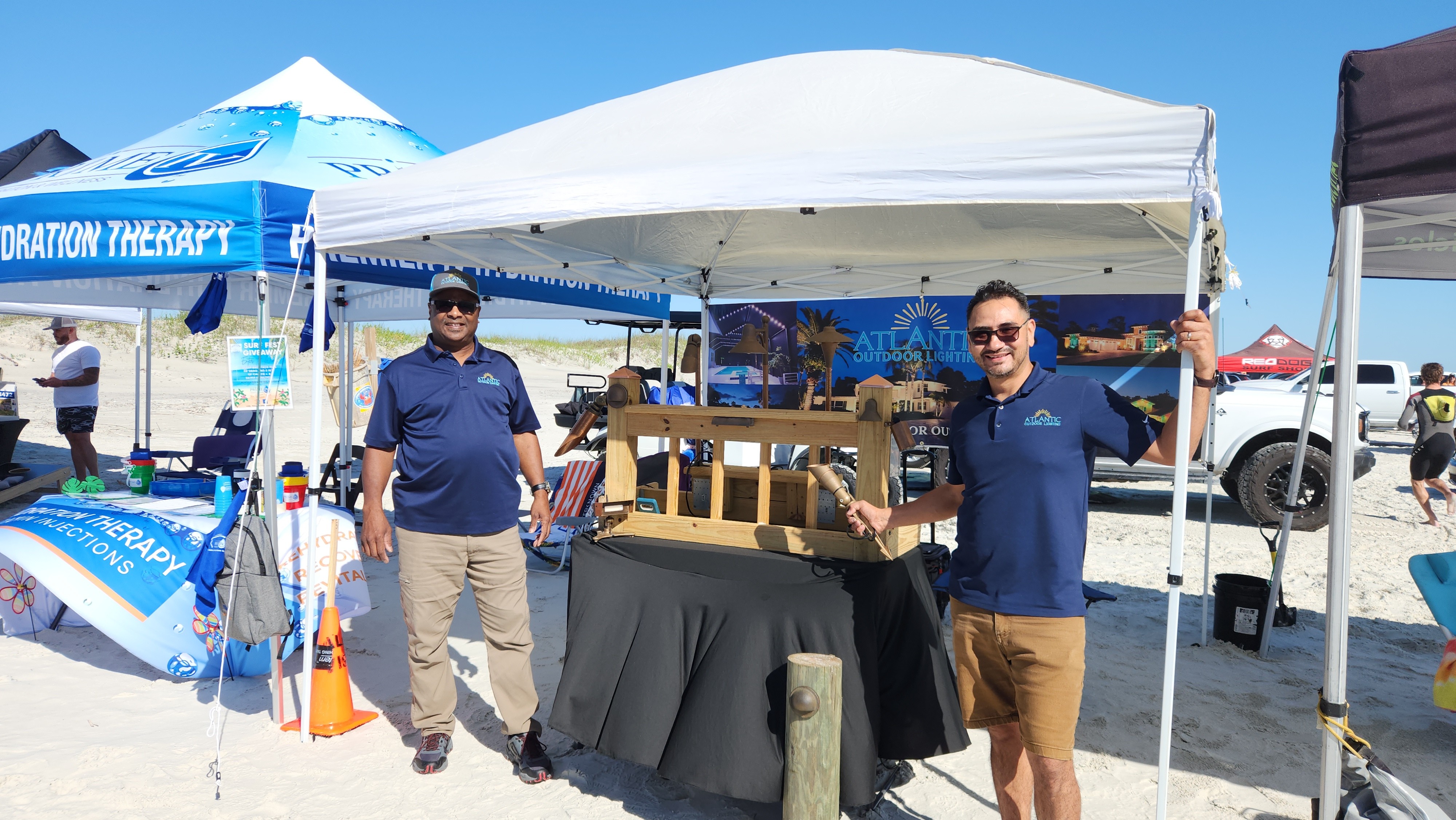 Atlantic Outdoor Lighting team hosting a community booth event in Volusia County