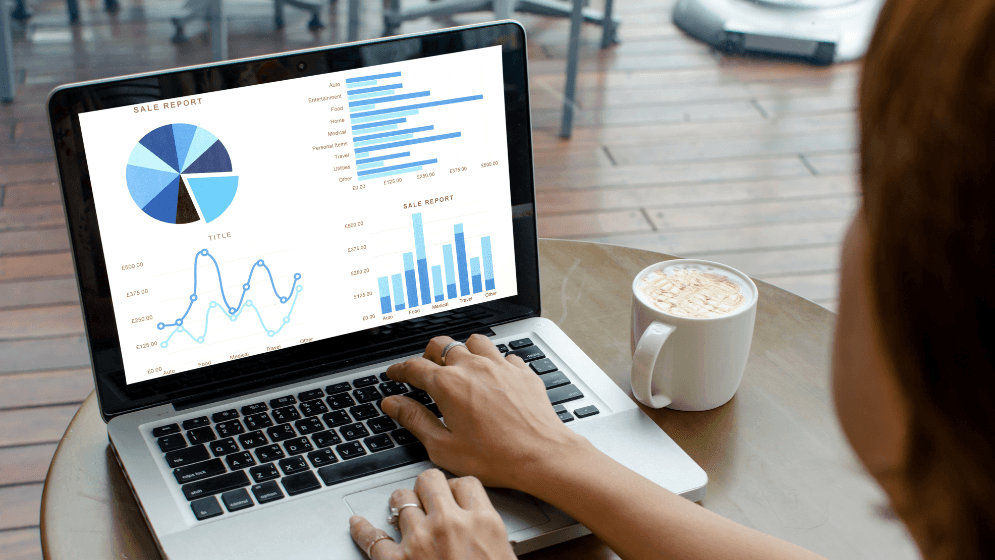 Person looking at sales reports on her laptop