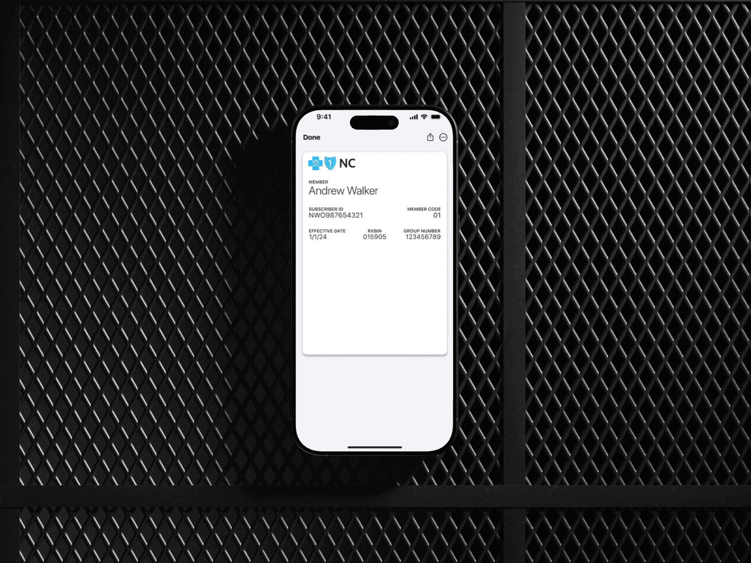 a cellphone leaning against a wall