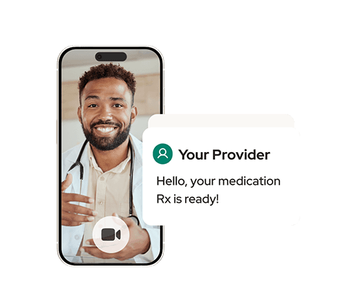 Male provider on a phone during a telehealth visit