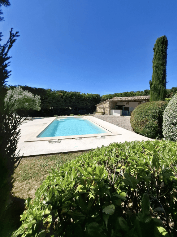 a room with a table, chairs, and a large window