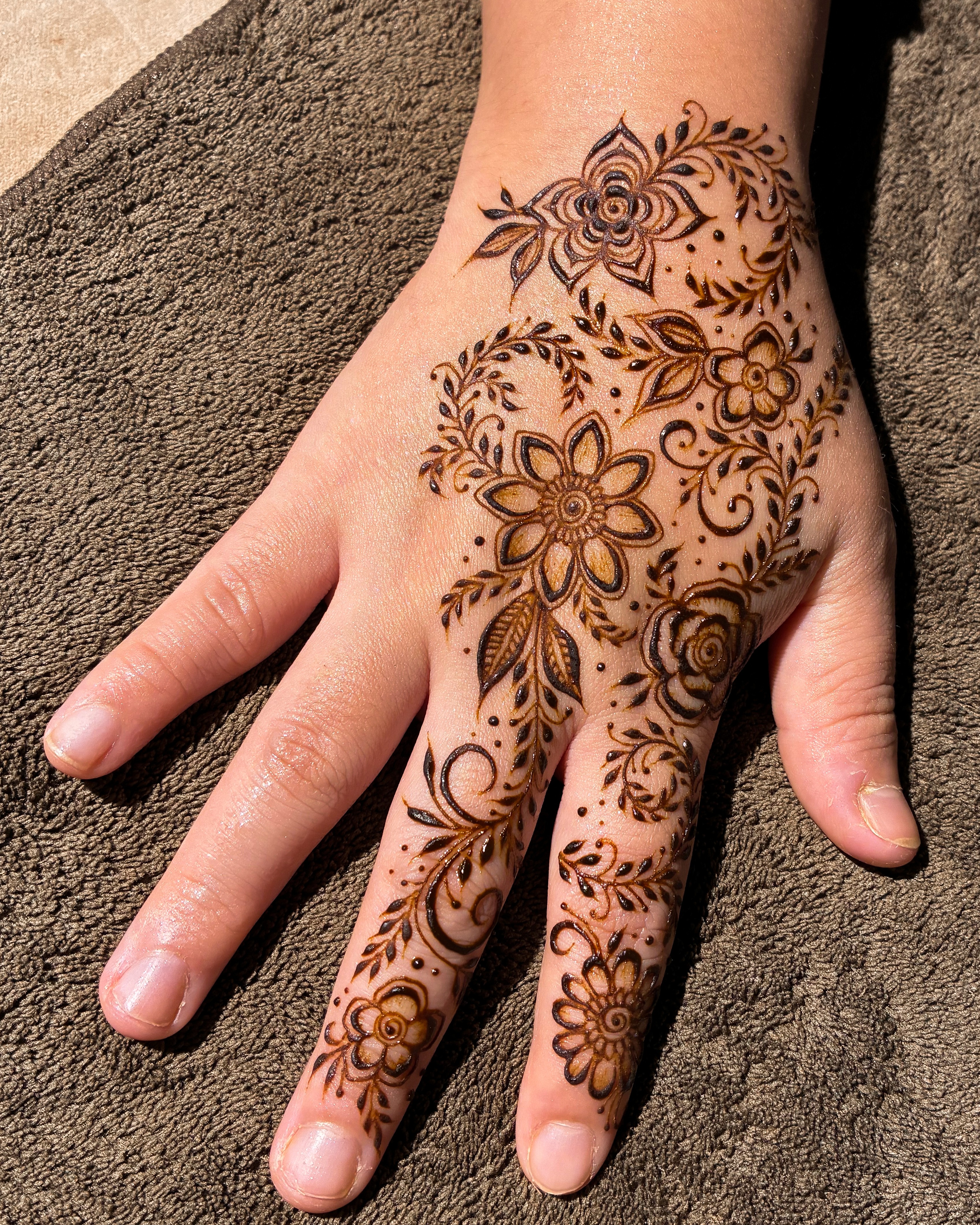 Personalised henna at an event in Singapore.