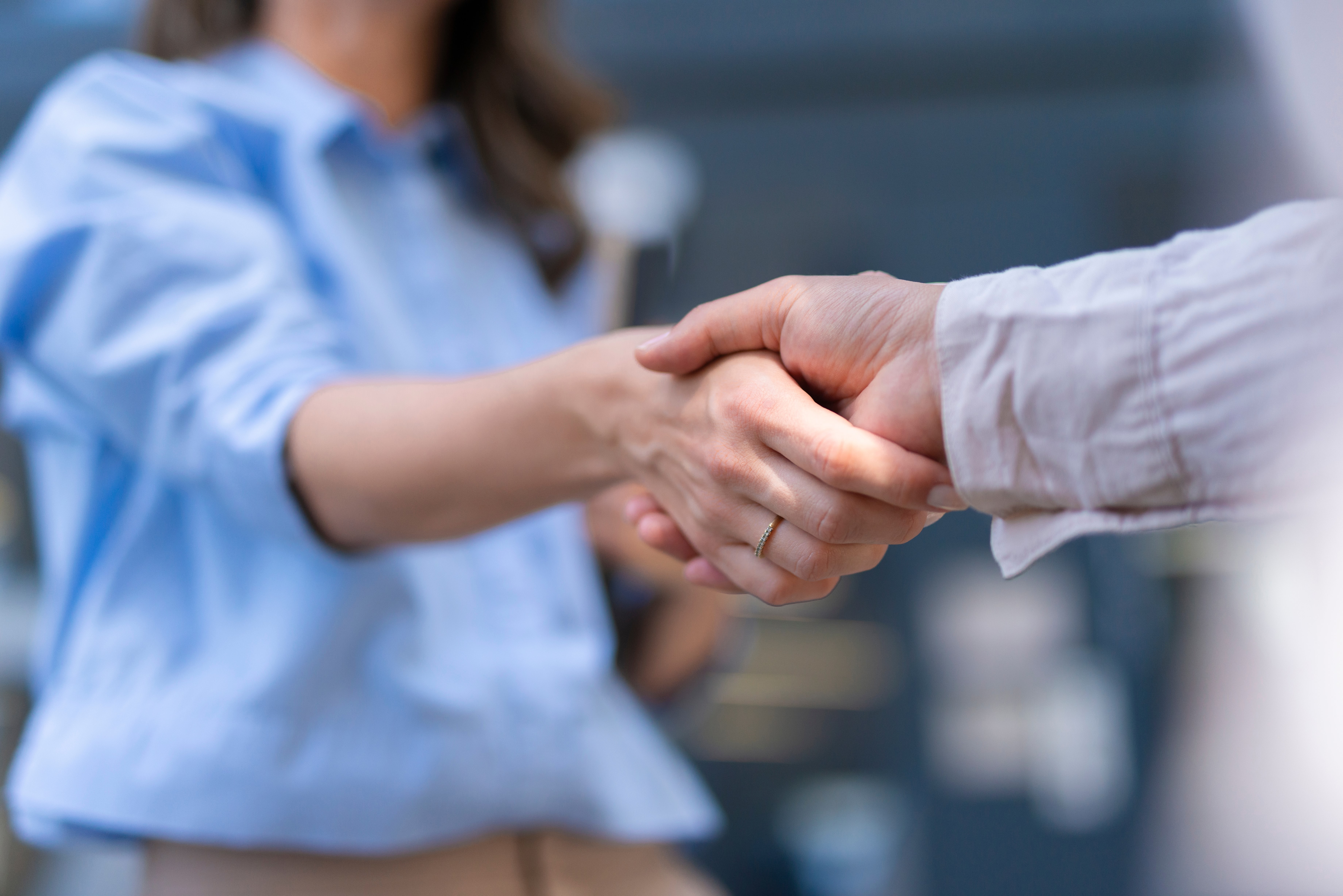 Two business professionals shaking hands